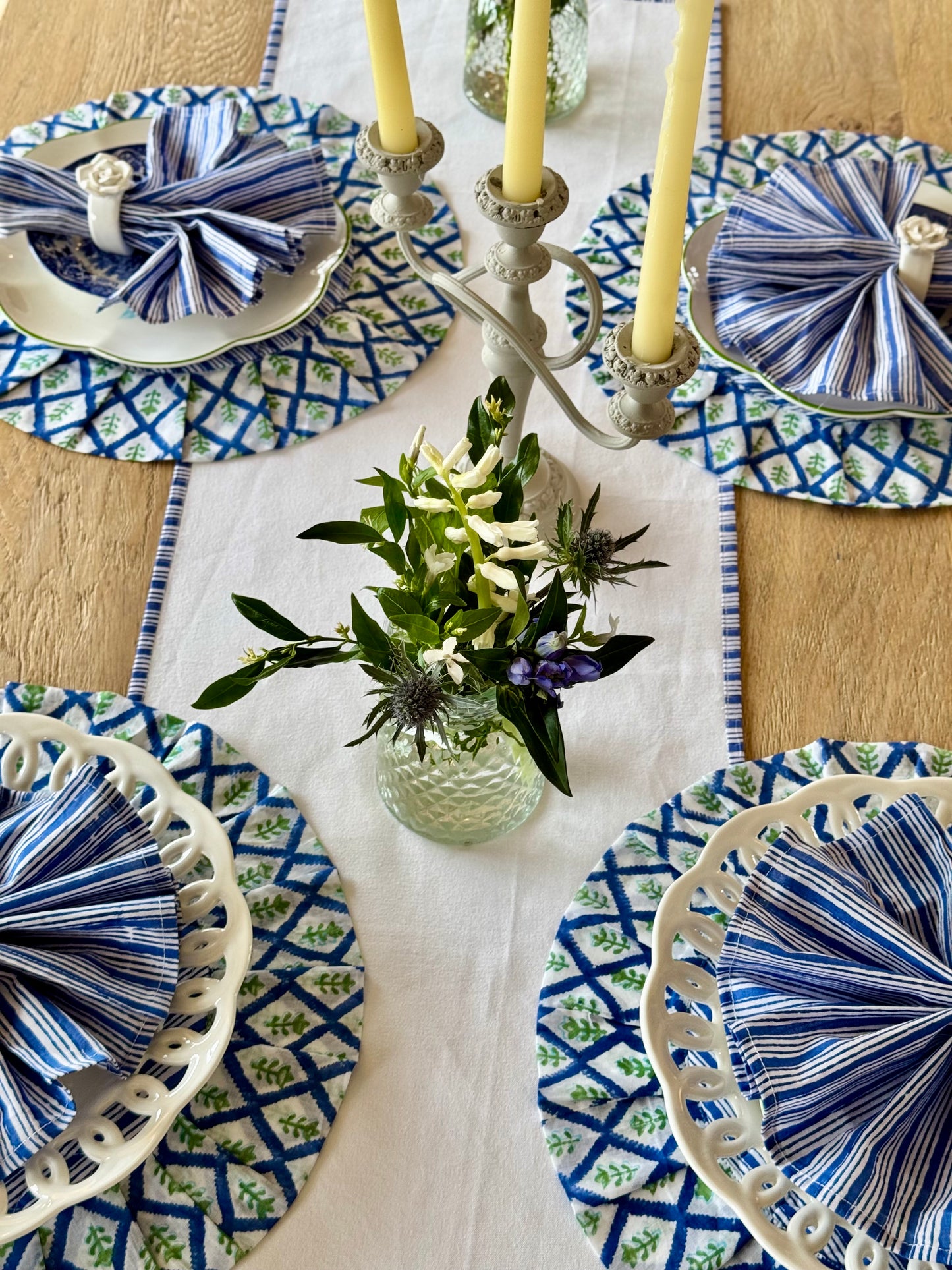 White table runner with a delicate blue striped edge detail