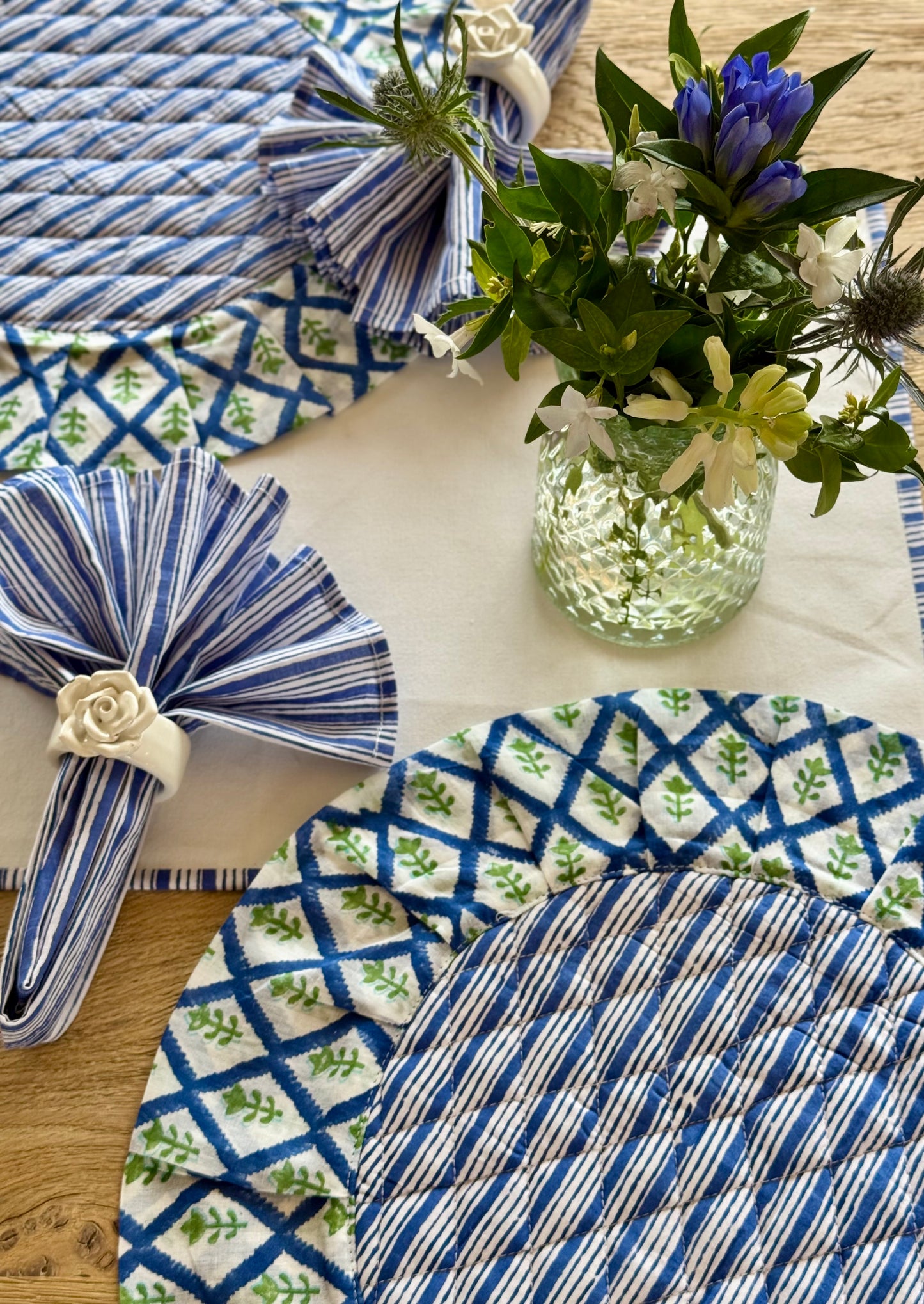 White table runner with a delicate blue striped edge detail